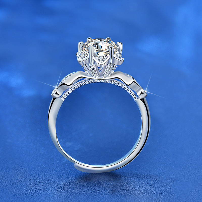 Side profile of starflower moissanite ring with cathedral setting, milgrain details and CZ accents in sterling silver.