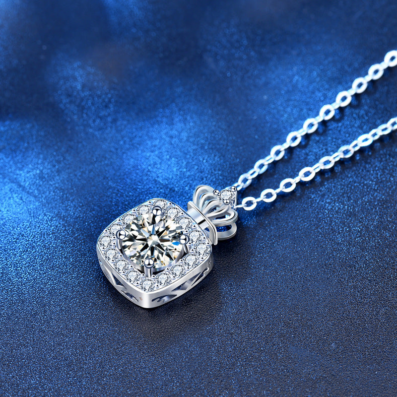 Detailed side angle of crown-style moissanite perfume bottle necklace showing facets and setting