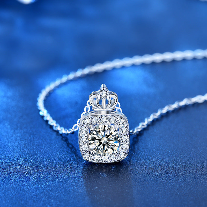 Sterling silver moissanite and CZ crown pendant necklace displayed with chain, highlighting sparkle