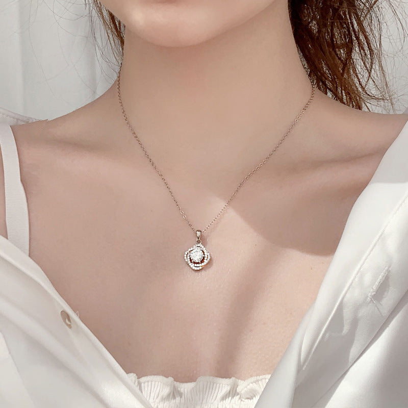 Elegant woman wearing 1 carat moissanite rose flower pendant necklace in 925 sterling silver at neckline