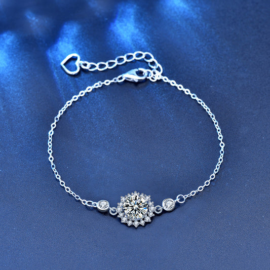 Sterling-silver moissanite sunflower bracelet with heart extender, flat lay
