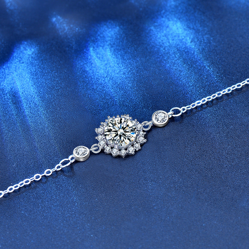 Detailed view of sunflower-cut moissanite bracelet with CZ side stones