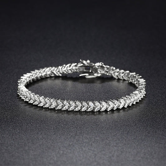 Close-up of wheat-link CZ bracelet in rhodium-plated 925 sterling silver.