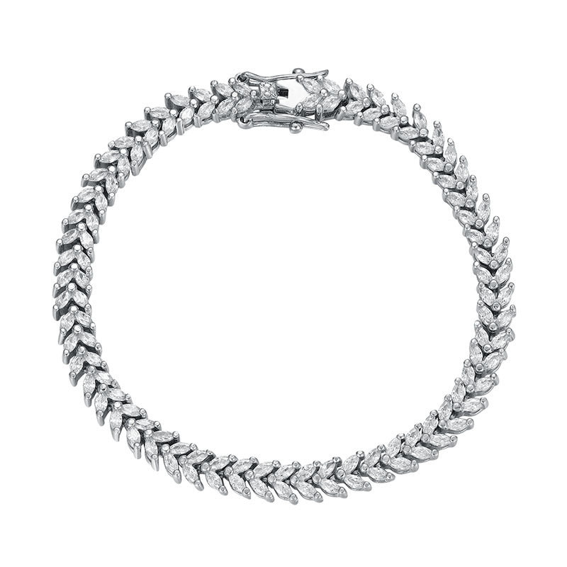 Product shot of rhodium-plated wheat-link CZ bracelet on white